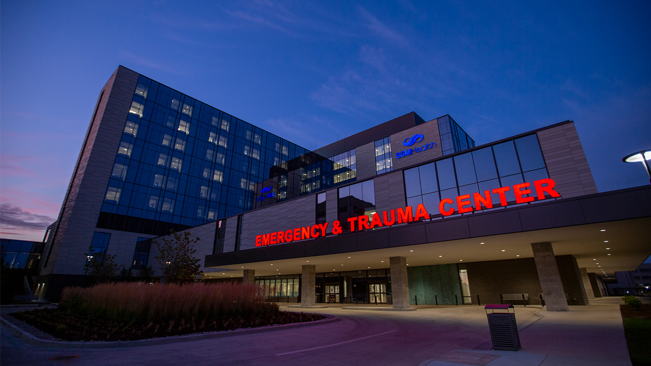 Emergency and Trauma Center at night. Exterior drop off area.