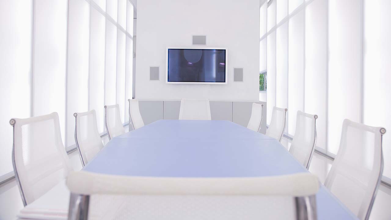 Conference room with audio video AV setup. Flat screen TV with high performance stereo speakers.